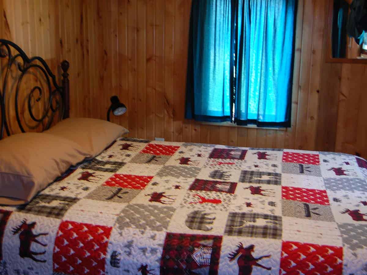 A Bed With A Quilt On It